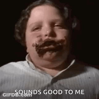 A Young Boy With Chocolate On His Face Is Making A Funny Face And Saying `` Sounds Good To Me '' . GIF