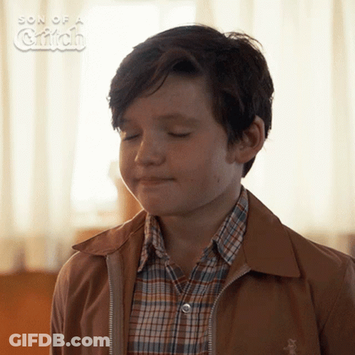 A Young Boy With His Eyes Closed In A Son Of A Griffin Photo GIF