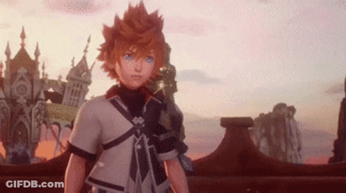 A Young Boy With Orange Hair And Blue Eyes Is Standing In Front Of A Castle In A Video Game . GIF