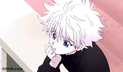 A Young Boy With White Hair And Blue Eyes Is Sitting At A Table With His Hand On His Chin GIF
