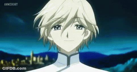 A Young Boy With White Hair And Blue Eyes Is Standing In Front Of A Blue Background . GIF
