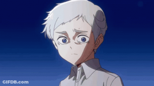 A Young Boy With White Hair And Blue Eyes Looks At The Camera GIF