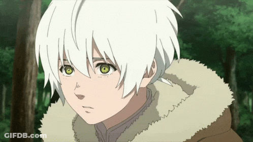 A Young Boy With White Hair And Green Eyes Looks At The Camera GIF