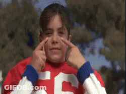 A Young Girl In A Red And White Jersey With The Number 55 On It GIF