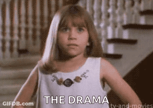 A Young Girl In A White Dress Is Standing In Front Of Stairs And Says The Drama . GIF