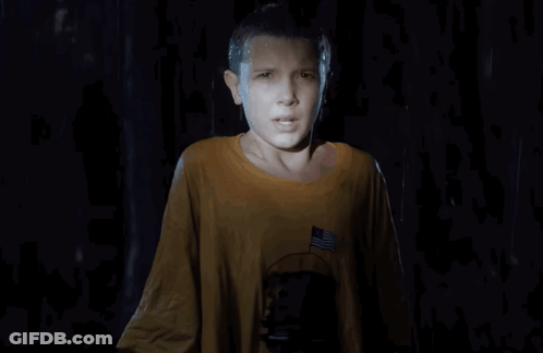 A Young Girl In A Yellow Shirt With An American Flag On The Pocket GIF