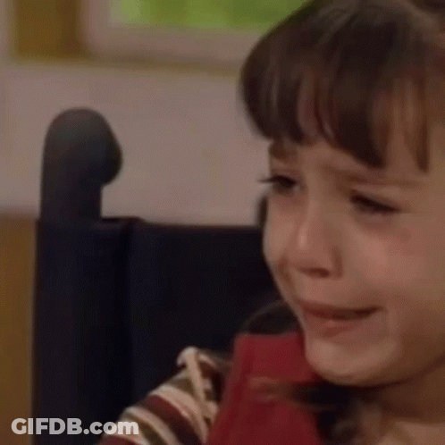 A Young Girl Is Crying In A Wheelchair . GIF