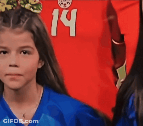 A Young Girl Wearing A Blue Shirt With The Number 14 On It GIF