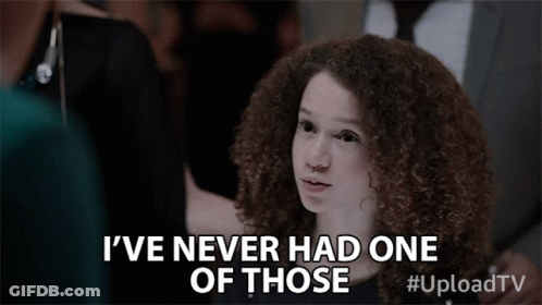 A Young Girl With Curly Hair Is Saying I 'Ve Never Had One Of Those GIF