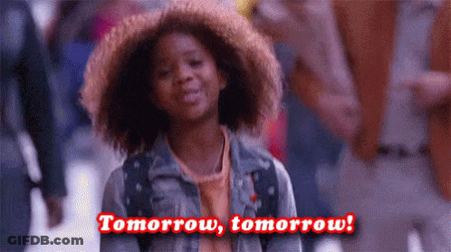 A Young Girl With Curly Hair Is Smiling And Says `` Tomorrow , Tomorrow ! '' . GIF