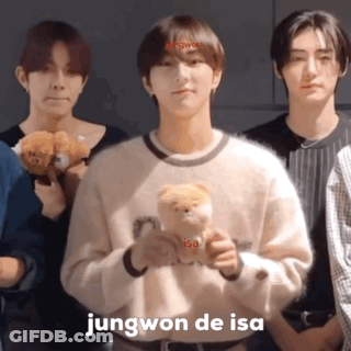 A Young Man Holding A Teddy Bear With The Name Jungwon De Isa Above Him GIF