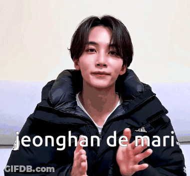 A Young Man In A Black Jacket With The Words Jeonghan De Mari GIF