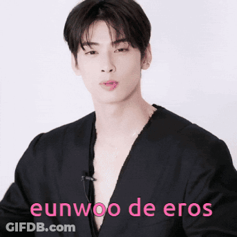 A Young Man In A Black Shirt With The Words Eunwoo De Eros Written On The Bottom GIF