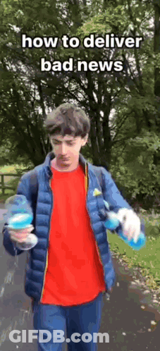 Young Man In Blue Jacket Holding Water Bottle GIF