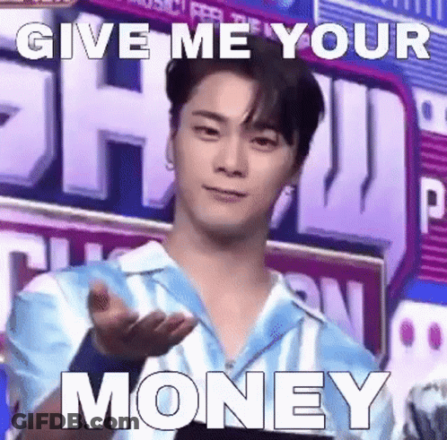A Young Man In A Blue Shirt Is Giving A Hand Gesture With The Words `` Give Me Your Money '' Written On It . GIF