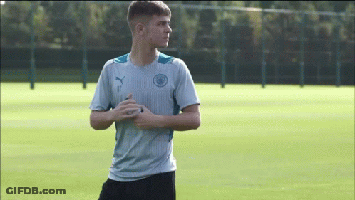 A Young Man In A Blue Shirt With The Number 11 On It GIF