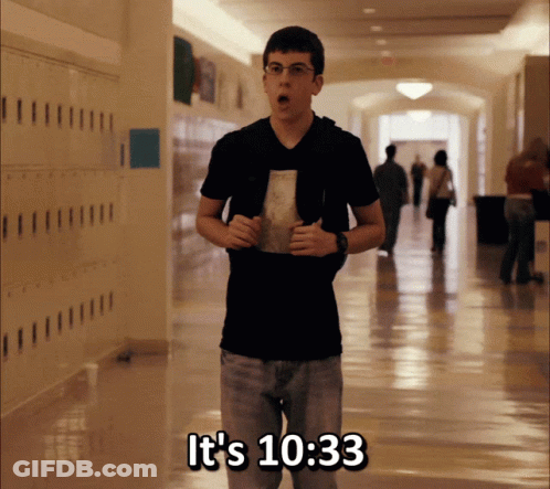 A Young Man In A Hallway With The Words It 'S 10:33 On The Bottom GIF