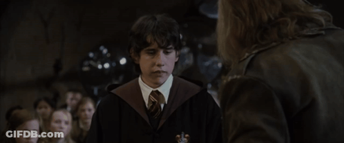 A Young Man In A Harry Potter Costume Talks To A Man In A Leather Jacket GIF
