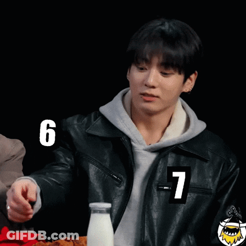 A Young Man In A Leather Jacket With The Number 7 On His Sleeve GIF