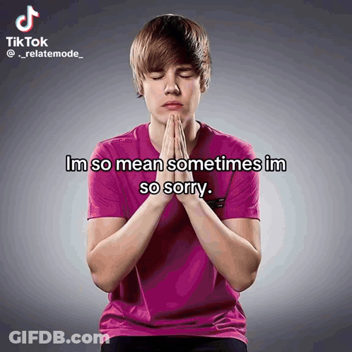 A Young Man In A Pink Shirt Is Praying With The Words Im So Mean Sometimes Im So Sorry Above Him GIF