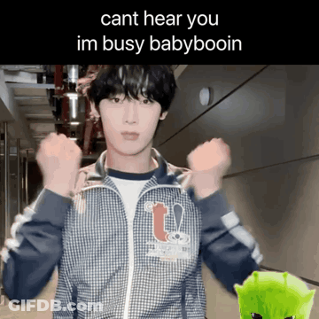A Young Man In A Plaid Jacket With The Words Cant Hear You Im Busy Babyboin On The Bottom GIF