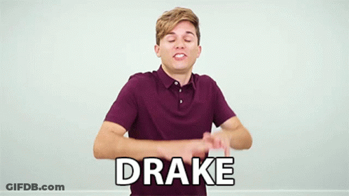 A Young Man In A Purple Shirt Is Making A Funny Face And Says Drake In White Letters . GIF
