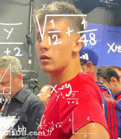 A Young Man In A Red Shirt Is Standing In Front Of A Blackboard With Mathematical Equations Written On It . GIF