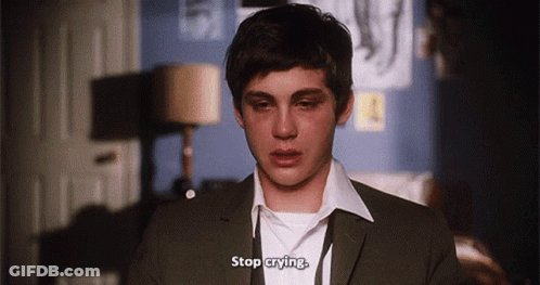 A Young Man In A Suit And White Shirt Is Crying And Says Stop Crying . GIF