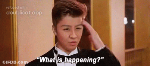 A Young Man In A Tuxedo Is Scratching His Head And Saying `` What Is Happening ? '' . GIF