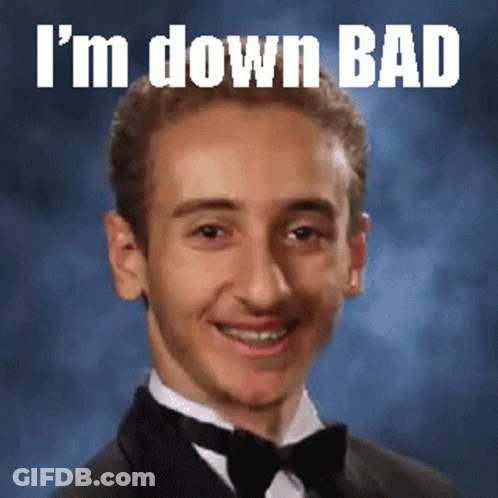 A Young Man In A Tuxedo With The Words I 'M Down Bad Written Above Him GIF
