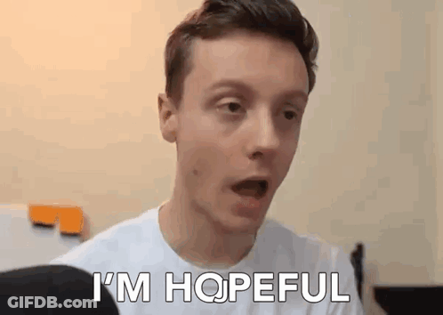 A Young Man In A White Shirt Is Making A Surprised Face And Saying `` I 'M Hopeful '' . GIF