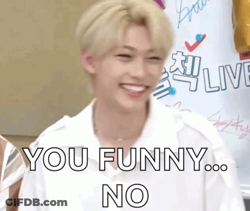 A Young Man In A White Shirt Is Smiling And Says You Funny No GIF