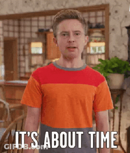 A Young Man In An Orange And Red Striped Shirt Says It 'S About Time . GIF