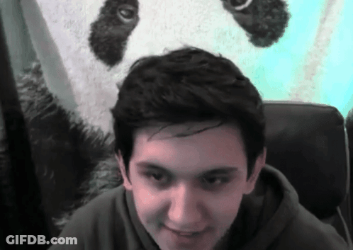A Young Man In Front Of A Panda Bear GIF
