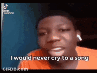 A Young Man Is Crying While Wearing Ear Buds And Says `` I Would Never Cry To A Song '' . GIF