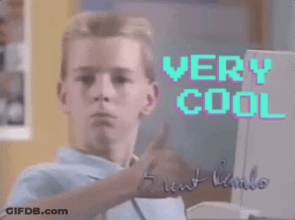A Young Man Is Giving A Thumbs Up In Front Of A Computer Screen That Says " Very Cool " GIF