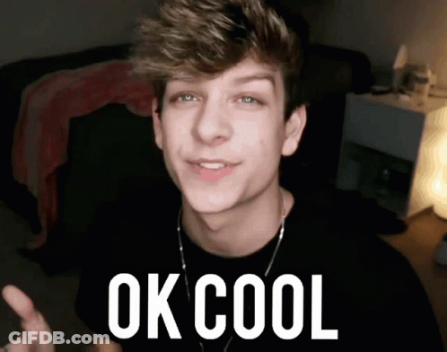 A Young Man Is Giving A Thumbs Up With The Words Ok Cool Behind Him GIF