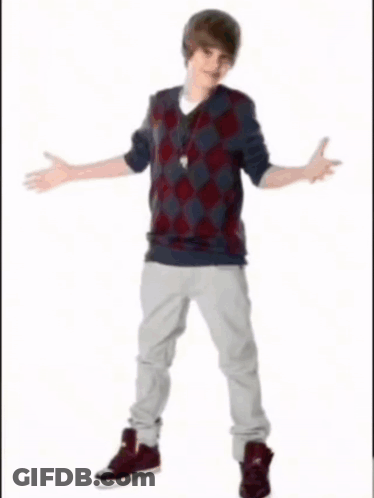 A Young Man Is Holding A Basketball In His Right Hand GIF