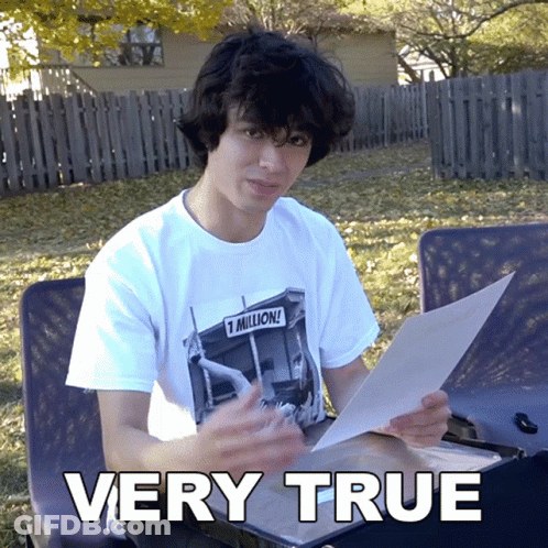 A Young Man Is Holding A Piece Of Paper And The Words Very True Are Above Him GIF