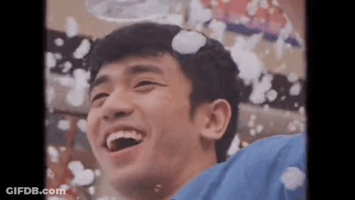 A Young Man Is Laughing While Bubbles Are Coming Out Of His Head . GIF