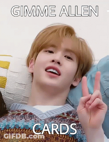 A Young Man Is Laying On A Bed And Making A Peace Sign With His Hand . GIF