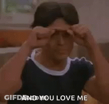 A Young Man Is Making A Fist Gesture And Says `` And You Love Me '' . GIF