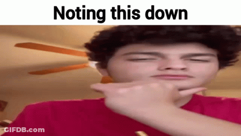 A Young Man Is Making A Funny Face And Pointing At Something . GIF