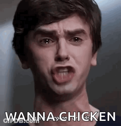 A Young Man Is Making A Funny Face And Saying `` Wanna Chicken '' With His Mouth Open . GIF