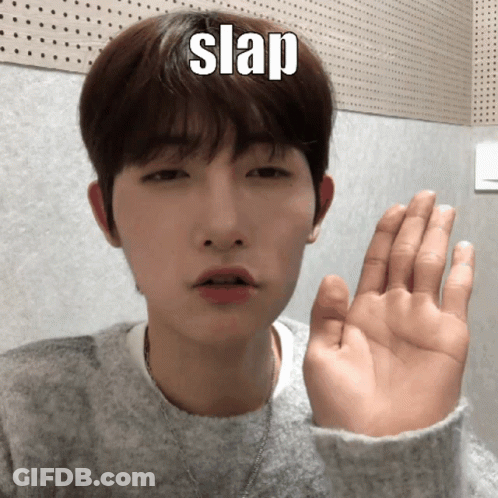 A Young Man Is Making A Funny Face With His Hand And The Word Slap Is On His Forehead GIF