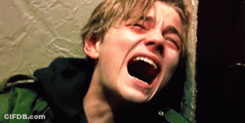 A Young Man Is Screaming With His Mouth Open . GIF