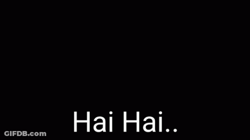 A Young Man Is Singing Into A Microphone With His Eyes Closed And The Words Hai Hai . GIF