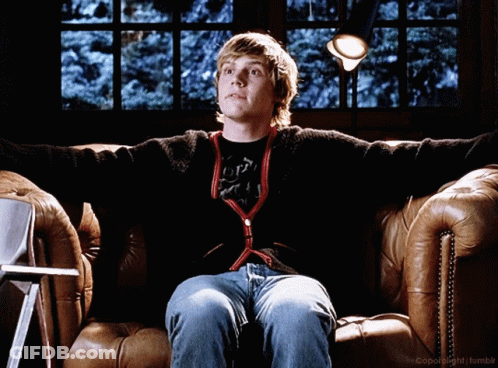 A Young Man Is Sitting On A Couch With His Arms Outstretched In Front Of A Window With The Words Copyright Tumblr On The GIF