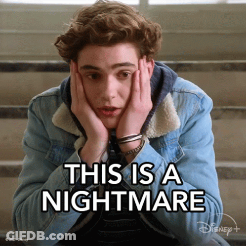A Young Man Is Sitting On A Set Of Stairs With His Hands On His Face And The Words This Is A Nightmare Above Him GIF
