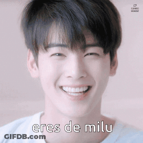 A Young Man Is Smiling With The Words Eres De Milu On His Face GIF